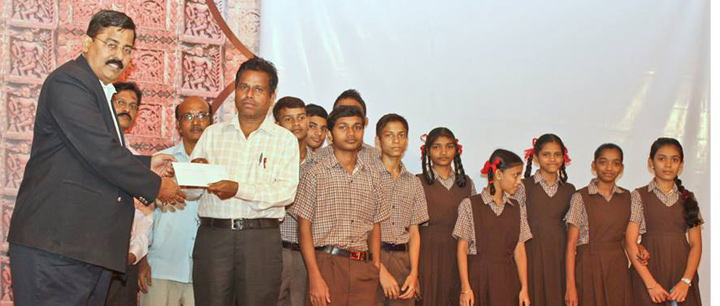 Scholarship being distributed to the students